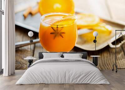 Fresh orange juice with orange slice and anise Wall mural