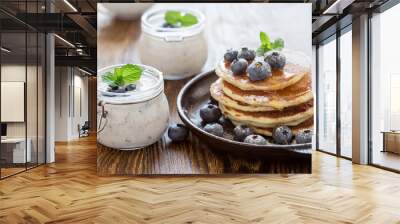 Healthy organic blueberry smoothie in glass jar and buttermilk pancakes Wall mural