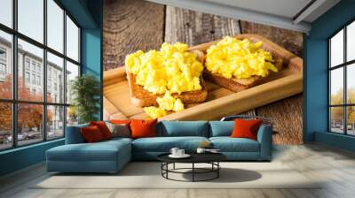 Scrambled eggs on two pieces of toast Wall mural