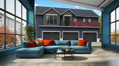 Modern blue house with a three-car garage and a balcony with a red railing. Wall mural