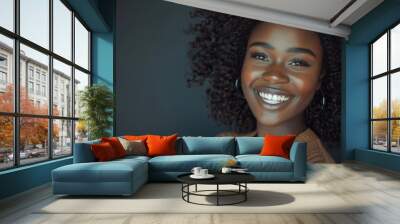 Beautiful black woman smiling in studio stock photo. Wall mural