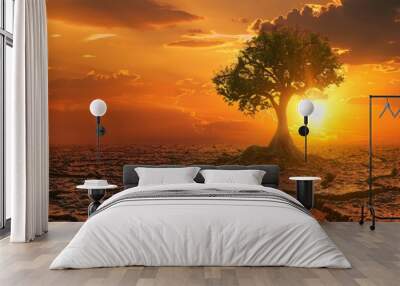 Dry land  cracked soil  green tree  global warming. Wall mural