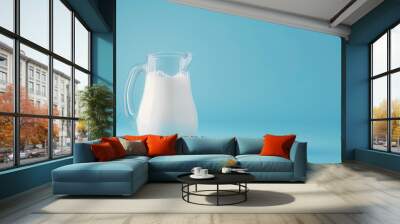 Farm dairy products concept with milk on blue background. Wall mural