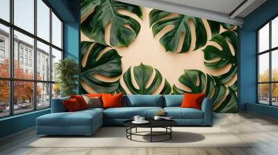 Monstera summer background with space for text  top view. Wall mural