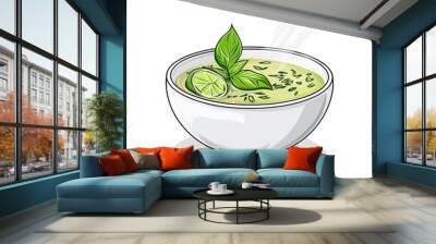 A steaming bowl of green soup garnished with lime and fresh herbs. Wall mural