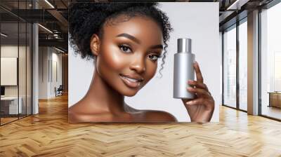 Beautiful Black Woman with Perfect Skin Holding a Bottle of Lotion. Wall mural