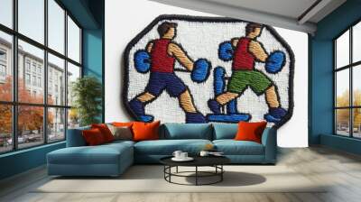 Two men wearing red shirts and blue shorts punching a boxing bag in an embroidered patch. Wall mural