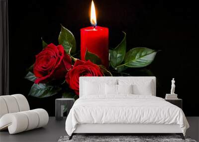 two red roses and a burning red candle on a black background Wall mural