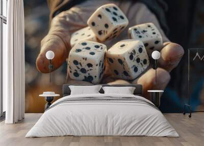 A hand is holding a bunch of dice, including a red, blue, and green one Wall mural