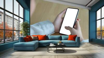 Asian woman holding smartphone with blank screen frameless modern design. Technology concept. Wall mural