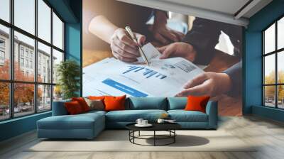 Business People Meeting to discuss and brainstorming the financial report paperwork in home office. Financial advisor teamwork and accounting concept. Wall mural