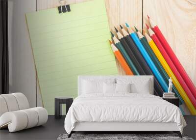 Notebook paper and school or office tools on wood table for back Wall mural