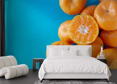 small mandarin oranges with blue backgrounds Wall mural