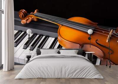 Violin on the piano on a black background Wall mural