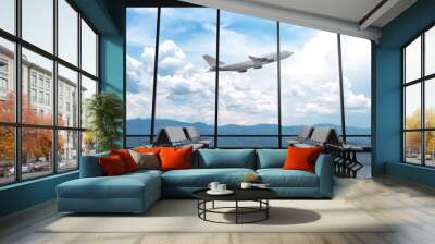 3D Rendering : illustration of at airport terminal. view from airport looked out. big window glass. airplane flying on blue sky background. travel around the world concept. ready for travel concept Wall mural