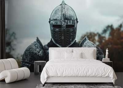 Man wearing Medieval Knights armor with heavy iron helmet Wall mural