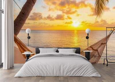 A serene beach at sunset, with a hammock between two palm trees, soft golden light reflecting off the waves Wall mural