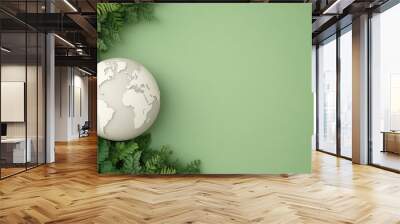 A serene representation of Earth surrounded by lush green ferns, ideal for eco-friendly and sustainability themes. Wall mural