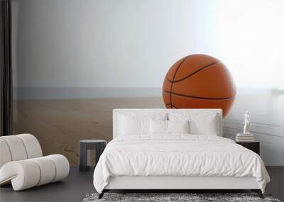 Basketball on hardwood floor, clean white background Wall mural