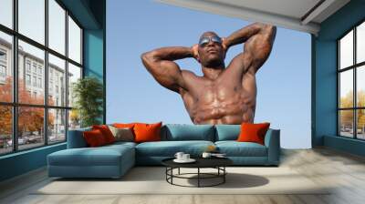 Strong bodybuilder man with perfect abs,biceps, chest Wall mural