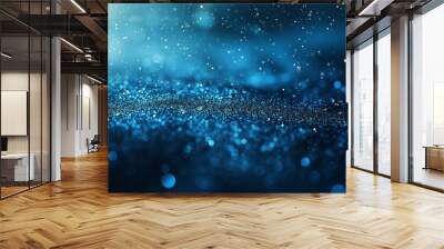 Abstract blue glitter background with bokeh lights and particles. Glittering night sky, dark background Wall mural