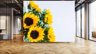 Bouquet of bright sunflowers on a white background. Wall mural