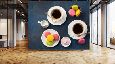 Two cups of coffee and sweets on table Wall mural