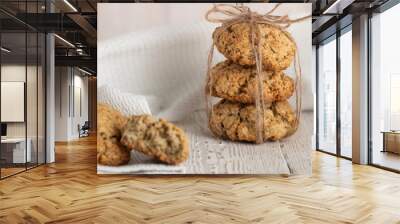 Oatmeal cookies with milk on tray on rustic wooden table Wall mural