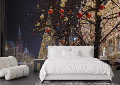 Russia, Moscow, Red Square, GUM Shopping Center on winter, snowing evening with a decorated tree in front. Wall mural