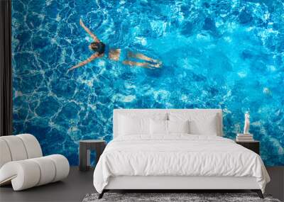 Active girl in swimming pool aerial drone view from above, young woman swims in blue water, tropical vacation, holiday on resort concept
 Wall mural