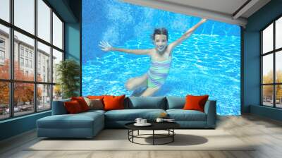 Happy girl swims in pool underwater, active kid swimming, playing and having fun
 Wall mural