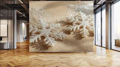 two beautiful snowflakes on a beige background with shadow. space for text, congratulations Wall mural