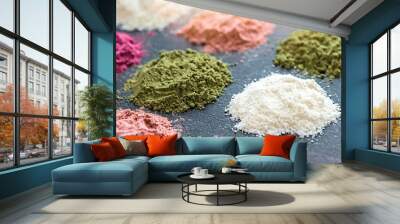 Various colorful superfood powders on dark background. Healthy food supplements, detoxing concept Wall mural