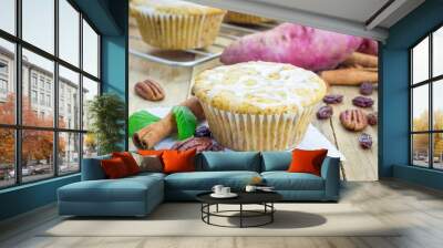 Citrus-glazed sweet potato muffins with pecan nuts and raisins Wall mural