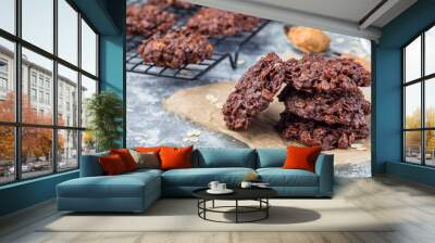 Flourless no bake peanut butter and oatmeal chocolate cookies on  parchment, horizontal, copy space Wall mural