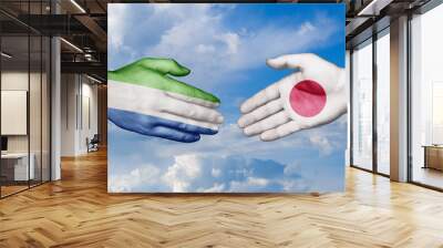 Japan and Sierra Leone country handshaking with flags, consensus concept international co-operation illustration Wall mural