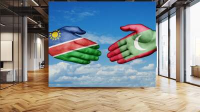 Maldives and Namibia country handshaking with flags, consensus concept international co-operation illustration Wall mural