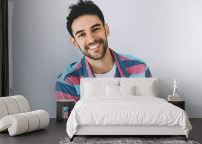 Close up portrait of handsome smart-looking smiling caucasian male model posing for social advertisement, isolated on white background with copy space for your promotional information or content. Wall mural