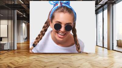 Close up portrait of young pretty woman wearing white t-shirt, blue headband and sunglasses with braids hairstyle, isolated on white background Wall mural