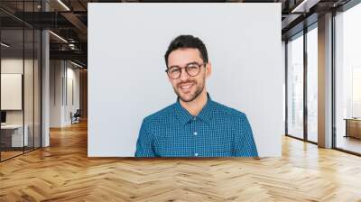 portrait of handsome smart-looking smiling male posing for social advertisement wearing blue shirt a Wall mural