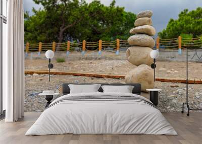 Pebble pyramid. Travel symbol. Background with copy space Wall mural