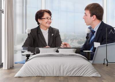 Elderly woman with a financial advisor Wall mural