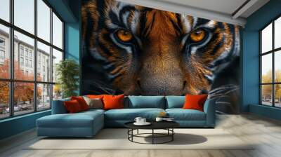 The tiger gazes intensely, highlighting its striking features in the dim light of evening Wall mural