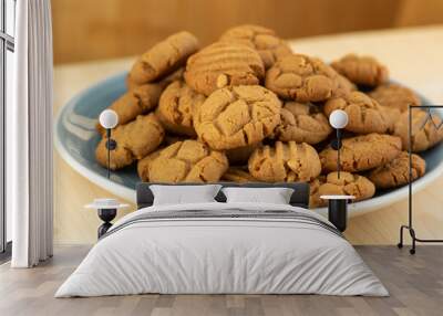 Very tasty peanut butter biscuits on bamboo light brown wooden board, golden baked healthy Wall mural