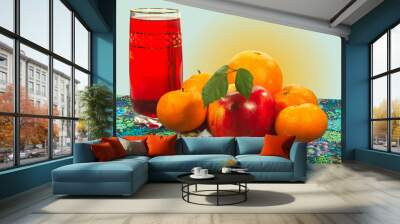 apple and citrus fruit on a plate, a glass of juice Wall mural