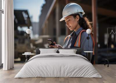 Beautiful construction manager in a white protective helmet and vest holding a phone on the background of construction. Construction business concept. generative ai
 Wall mural