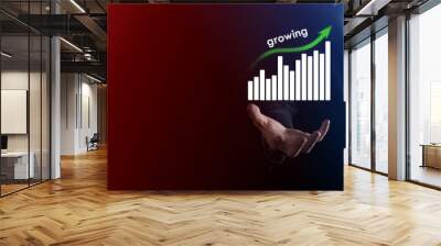 Business man holding holographic graphs and stock market statistics gain profits. Concept of growth planning and business strategy. Display of good economy form digital screen. Wall mural