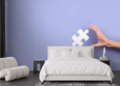 Businessman hands connecting puzzle pieces representing the merging of two companies or joint venture, partnership, Mergers and acquisition concept. Wall mural