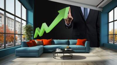 Businessman hold drawing on screen growing graph, arrow of positive growth icon.pointing at creative business chart with upward arrows.Financial, business growth concept Wall mural