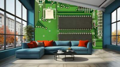 Closeup two chips with space for your text on a green circuit board for background. Wall mural